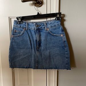 Top shop denim skirt. Never worn. 18$